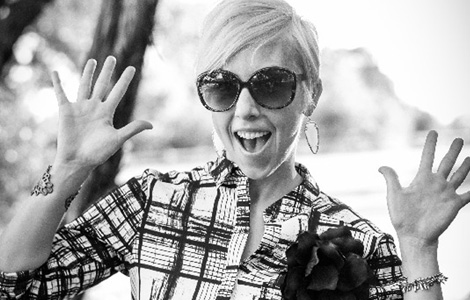 Smiling woman with her hands up Smiling woman with her hands up